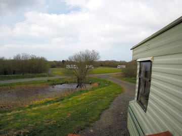 View from front of static caravan towards pond and woody's lake