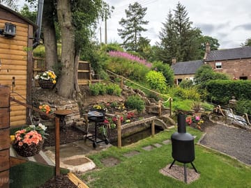 Main lawn with a barbecue and chiminea