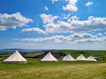 A row of bell tents