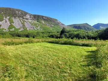Grass pitch and gyrn ddu mountain