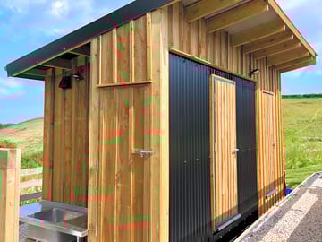 There are two shower rooms, both unisex, plus an outside kitchen sink with hot water