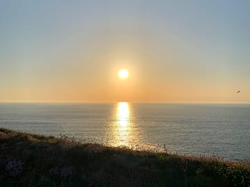 Sunset over the ocean from the coastal path