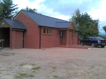 Heated toilet and shower block
