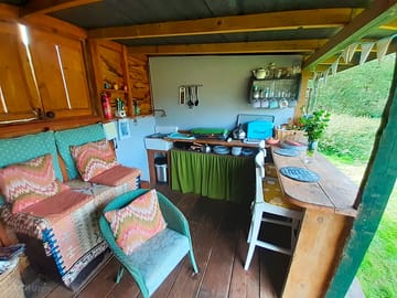 The kitchen and living area is next door to the bedroom
