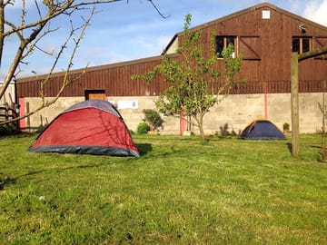 The site is next to a big barn