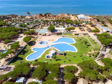 Aerial view of the site, pool and beach