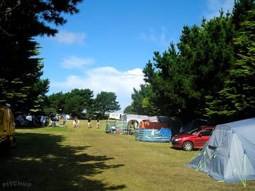 Large non-electric grass tent pitch
