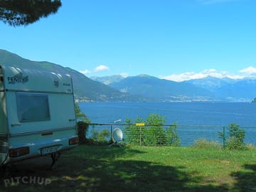Shaded pitch with lake view