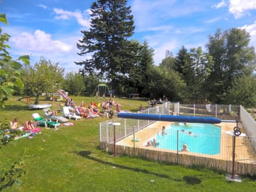 Swimming pool and grass sun terrace