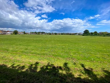 The campsite! Spacious, flat and plenty of room to kick a ball around.