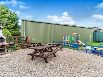 Barbecue and picnic area next to the playground