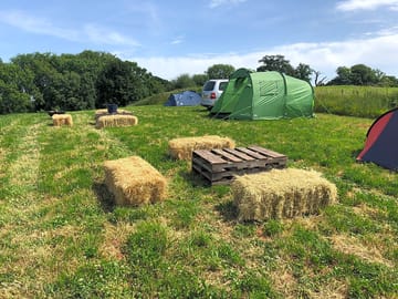 Hale bales around a firepit area