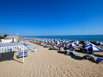 The beach where you'll spend your time relaxing with sun and clear water