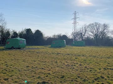 Camping field surrounded by trees