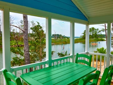 All cottages have a screened porch which includes a dining table and chairs