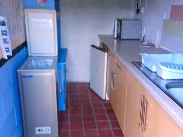 Washing up area including fridge, small freezer, microwave and usb phone charging points