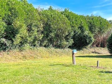 Pitches backed by trees