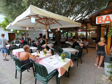 Relax with a drink or a meal at the campsite bar