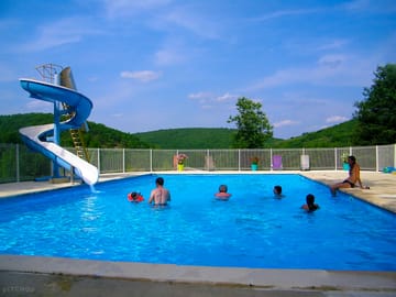 Heated outdoor pool with waterslide