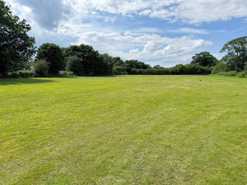 Spacious neatly mown camping field