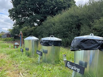 Bins and water tap on site.