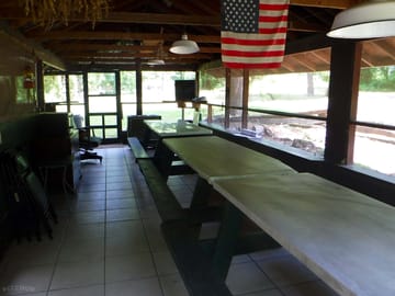 The dining area near the kitchen. you will find additional picnic tables outside