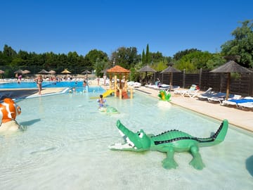 Paddling pool in the waterpark with a slide