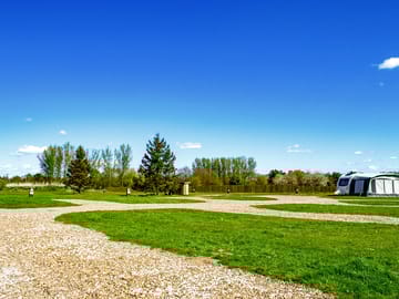 Electric hardstanding and grass touring pitch