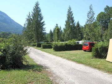 Grass pitches surrounded by greenery