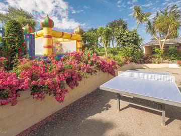 Bouncy castle and outdoor ping pong table