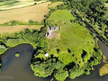 Aerial view of the farm and field available for camping