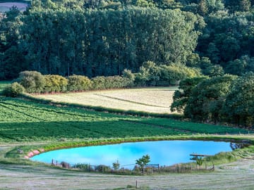 The lake forms a focal point in the field