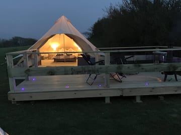 Private patio with table, chairs and loungers