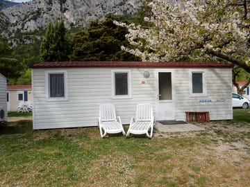 Outside a two-bedroom caravan