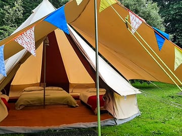 Bell tent with awning and bunting