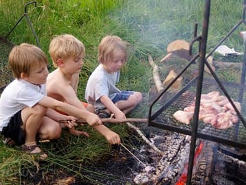 Children cooking supper
