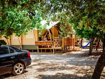 Room for one car by each tent