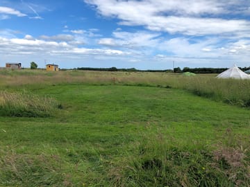 Large grass pitch mown into the meadow