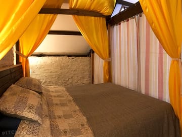 Hay loft main bed with area curtains drawn
