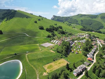 Electric hardstanding and grass touring pitch