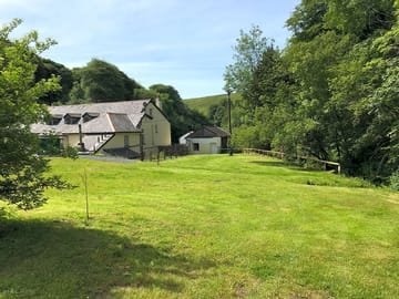 Grass pitches along Ashcombe water