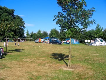 A green and tree-lined site