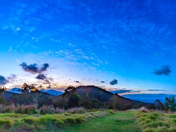 Setting sun from cleared ridge