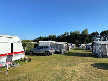Electric grass and gravel touring caravan pitch