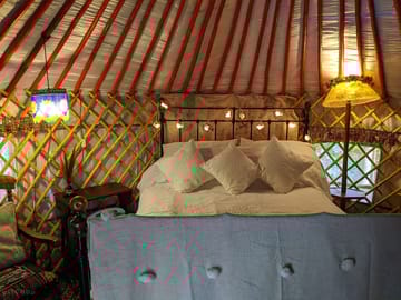 Comfy double brass bed with cotton bedding