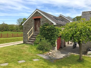 Hay loft steps and garden area, including area for cooking