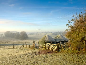Yurts against a rural backdrop