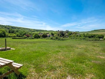 Camping field surrounded by trees