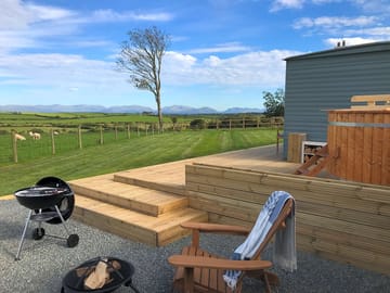 Stunning views across open farmland to Snowdonia