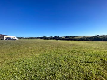 View of our pitches, showing the gradual slope down to our woodland
